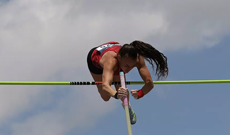 Brynn King vaults over bar