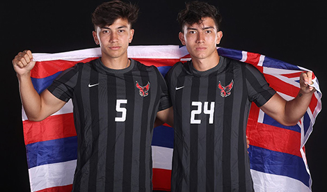 Noah and Toby Balaam hold a flag