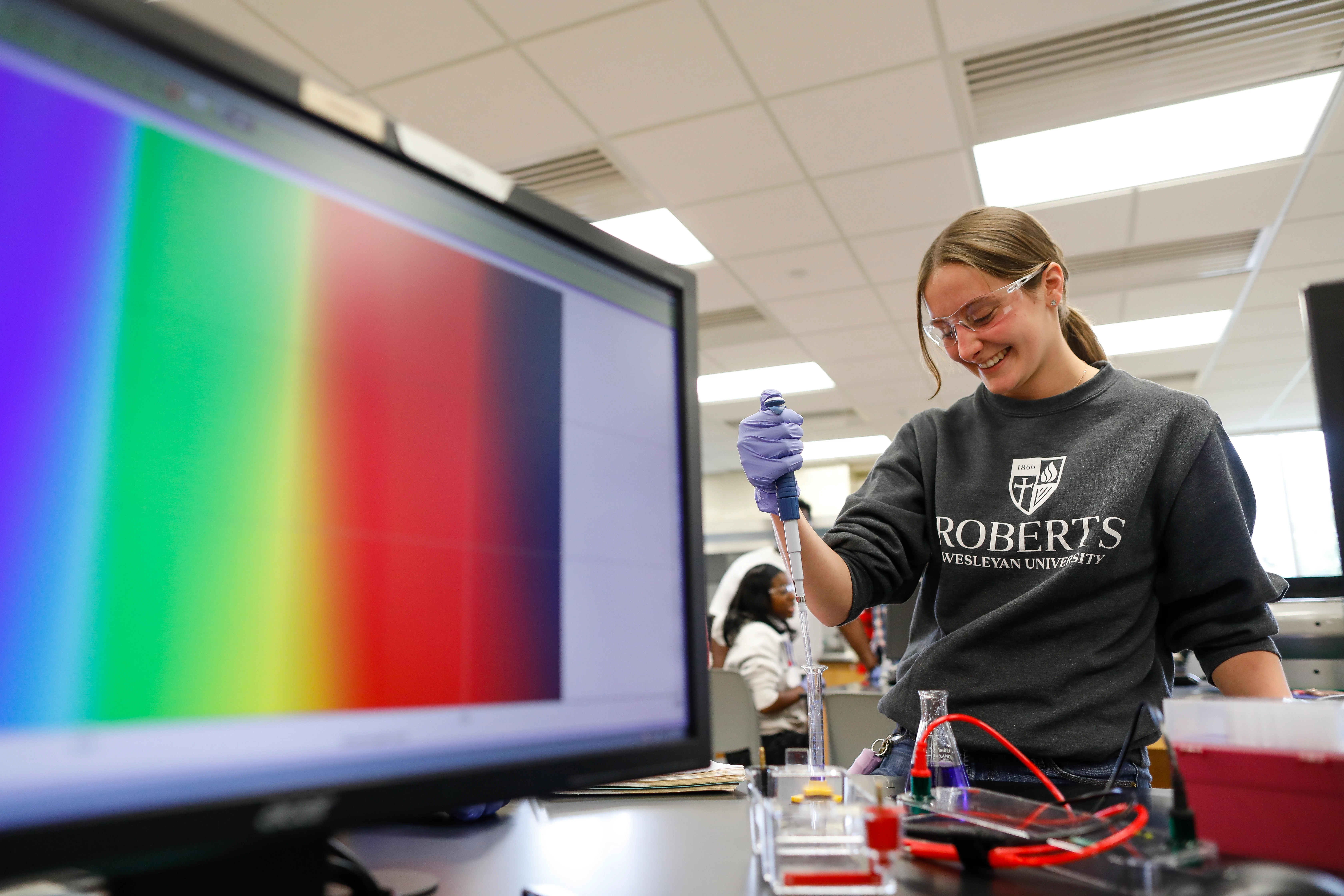 A Roberts Wesleyan student in the lab