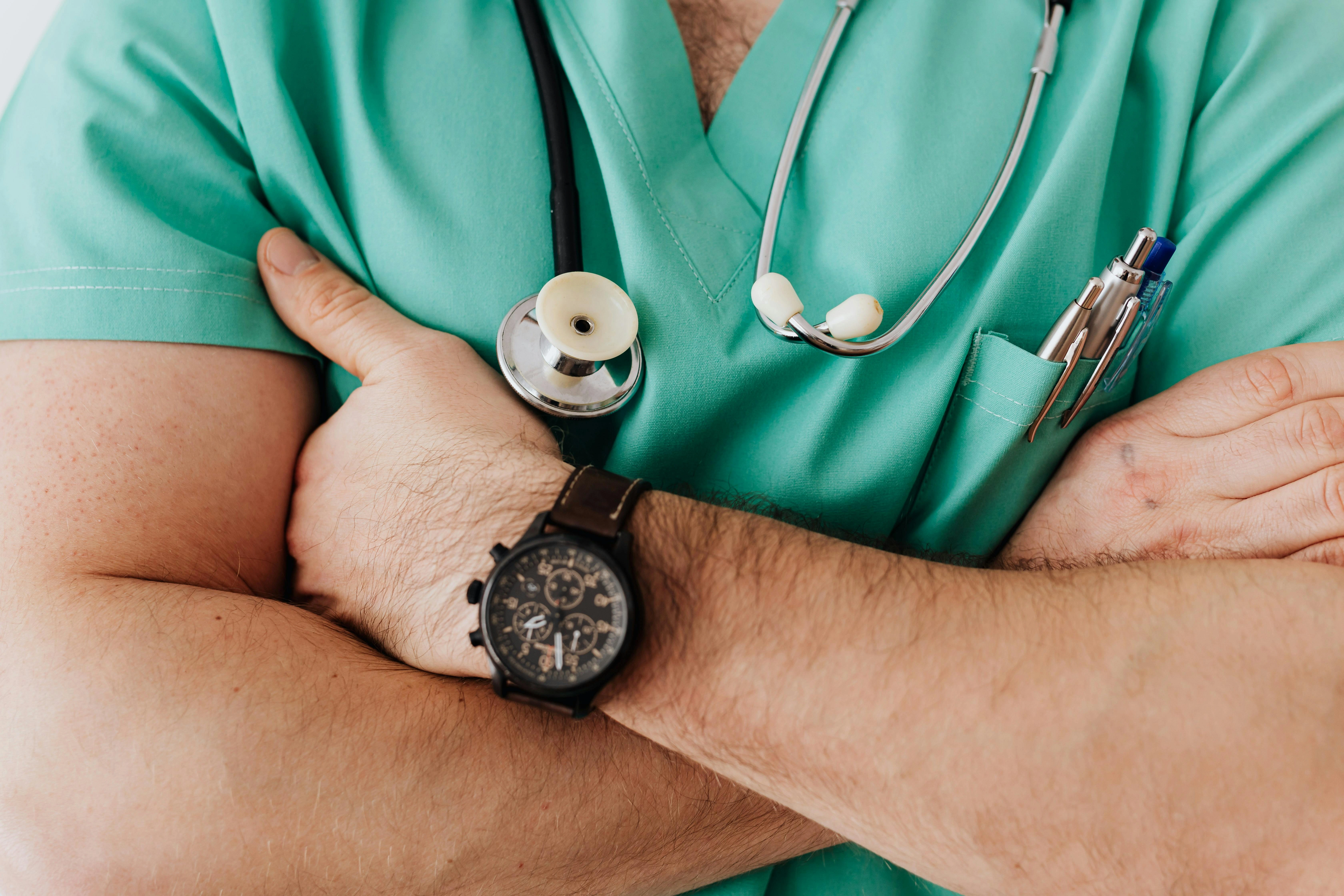 A male nurse with his arms crossed